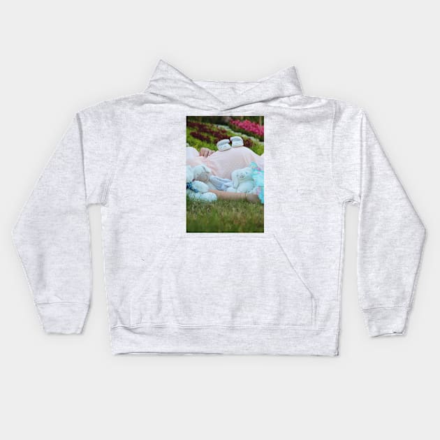 pregnant woman in the park surrounded by stuffed toys Kids Hoodie by psychoshadow